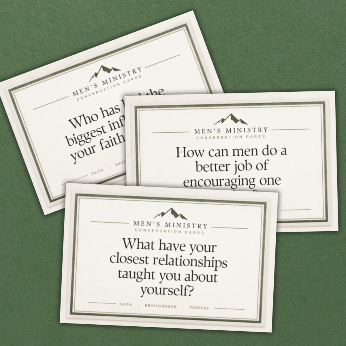 Three cream-colored conversation cards with black text and borders, arranged on a solid dark green background. The cards are branded 'MEN'S MINISTRY CONVERSATION CARDS' and feature prompts about faith, encouraging men, and personal relationships.